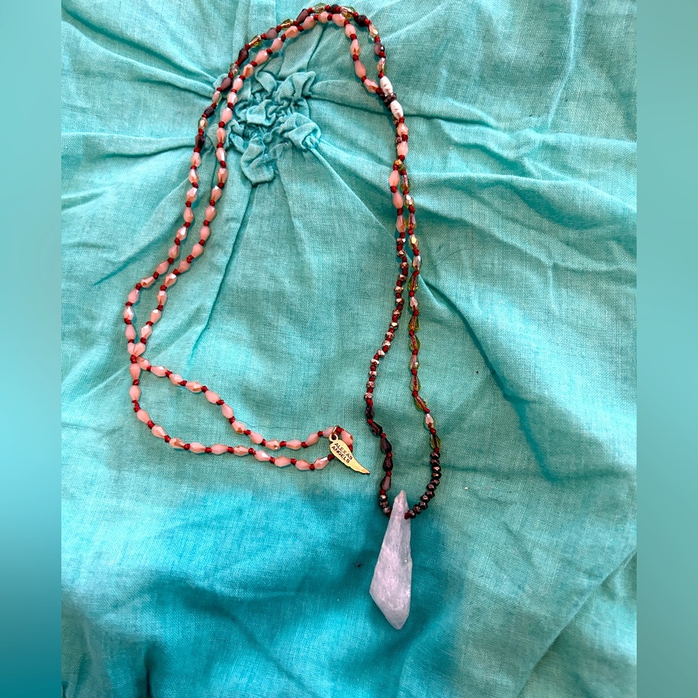 Beaded necklace with raw crystal